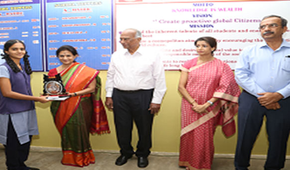 A girl student getting an award